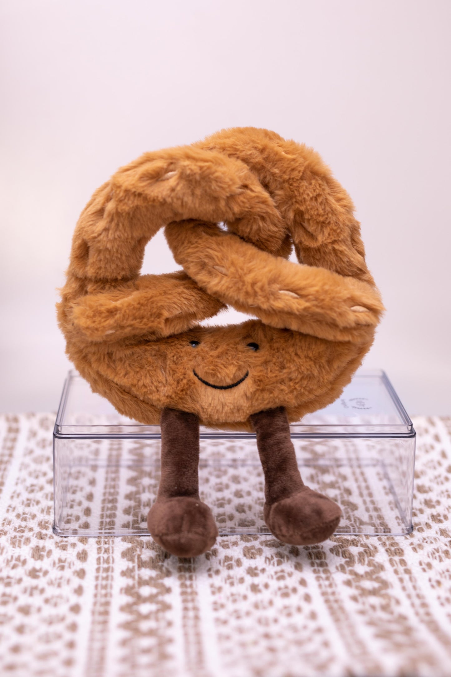 Plush squeaky pretzel dog toy
